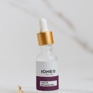 A product picture of a glass dropper bottle with a white and gold top. It also contains a purple and white label.